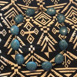 Turquoise and gold colored chunky beaded necklace